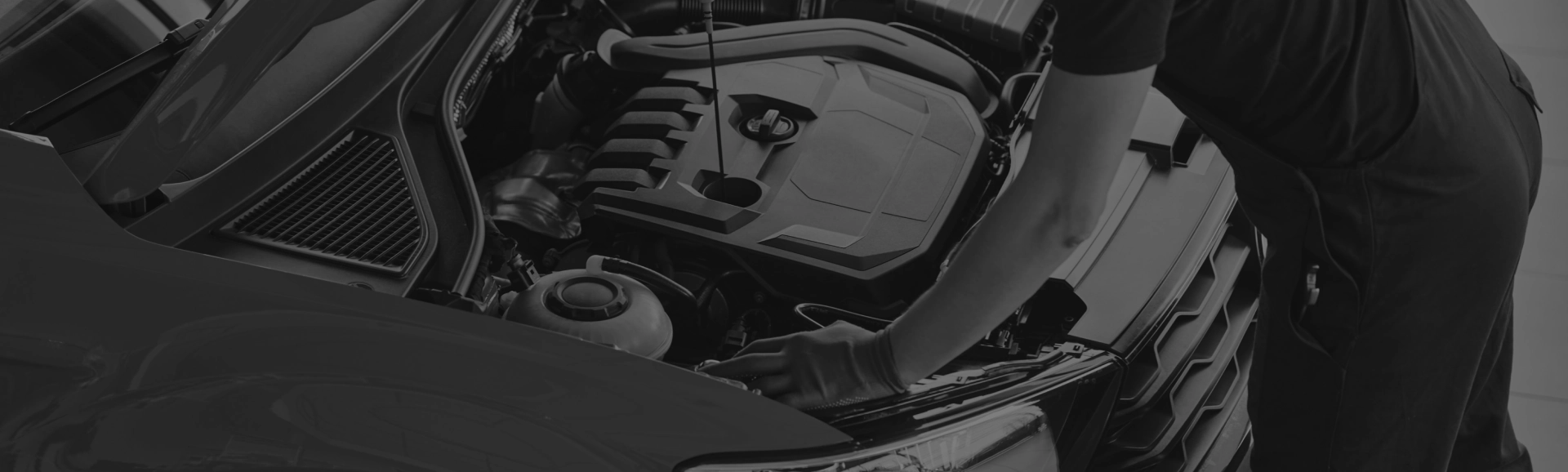 Mechanic working on a car engine